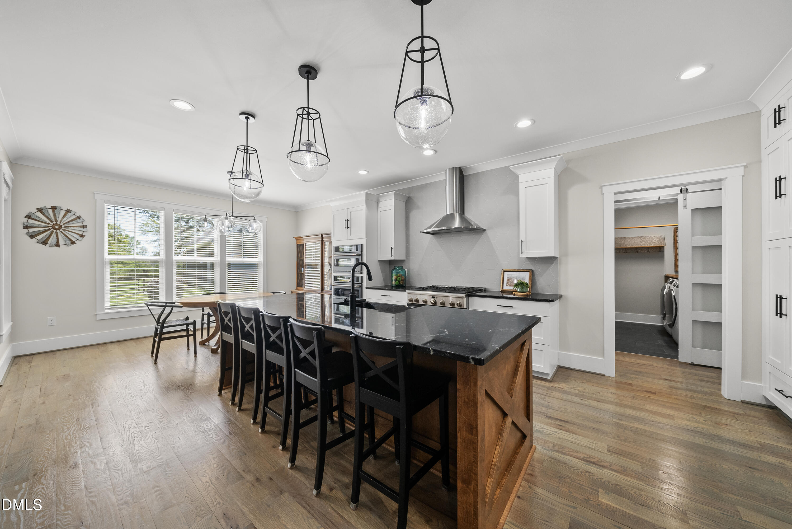 2416 Eddie Howard Road Willow Spring, NC 27592 - Photo 40 of 64 a view of a dining room with furniture window and wooden floor