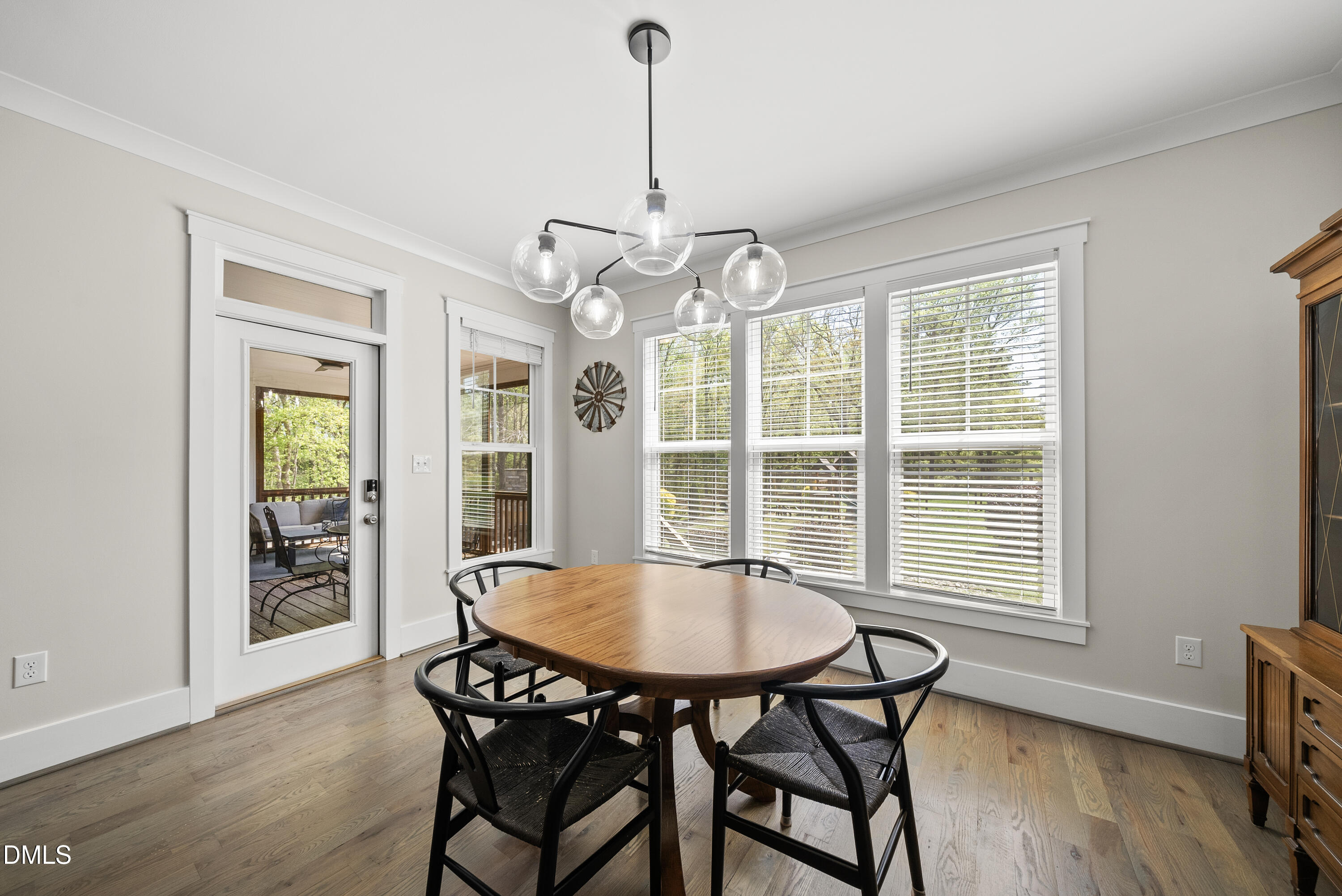 2416 Eddie Howard Road Willow Spring, NC 27592 - Photo 43 of 64 a view of a dining room with furniture window and wooden floor