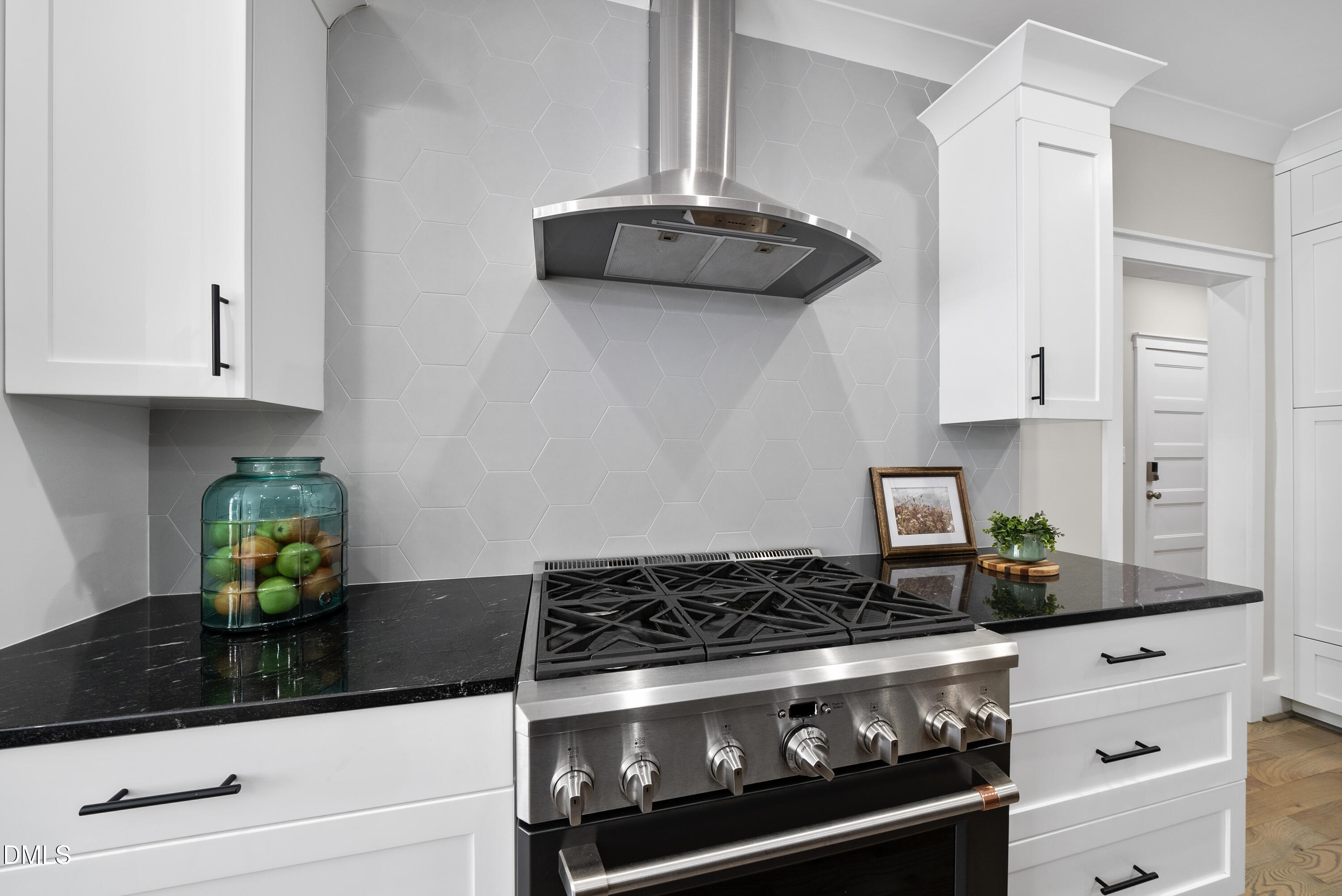 2416 Eddie Howard Road Willow Spring, NC 27592 - Photo 47 of 64 a close view of a stove a microwave and cabinets in the kitchen