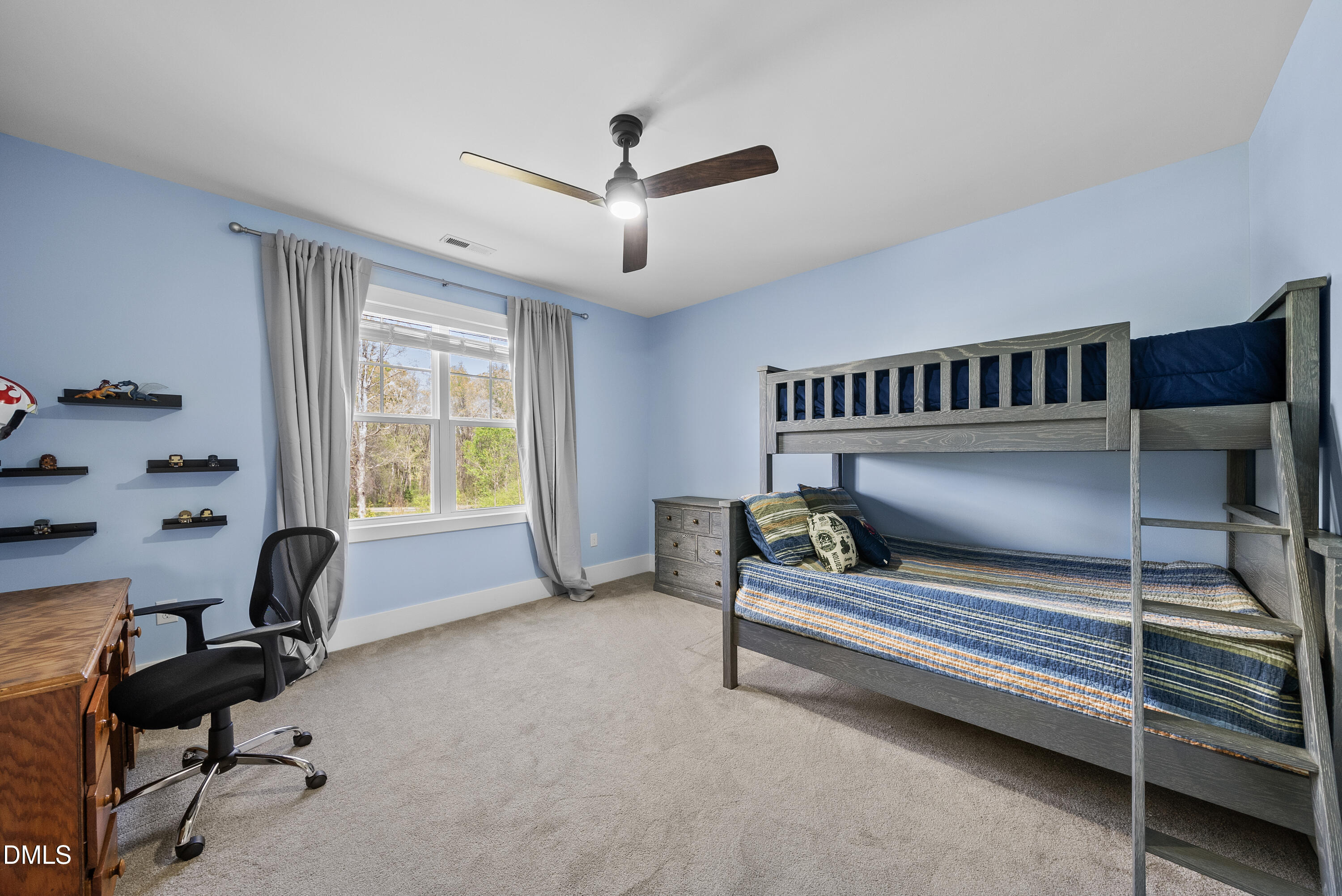 2416 Eddie Howard Road Willow Spring, NC 27592 - Photo 50 of 64 a bedroom with furniture and a window
