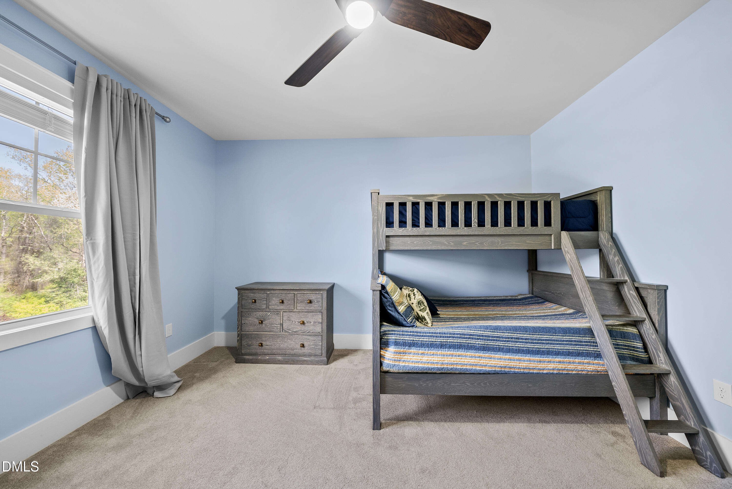 2416 Eddie Howard Road Willow Spring, NC 27592 - Photo 51 of 64 a bedroom with furniture and a window