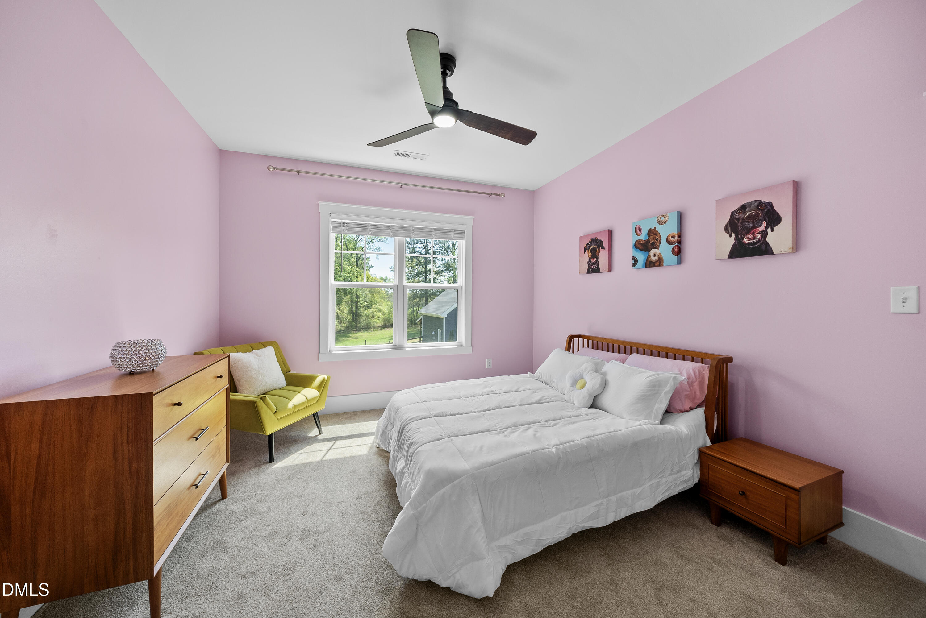 2416 Eddie Howard Road Willow Spring, NC 27592 - Photo 53 of 64 a bedroom with a bed and a window