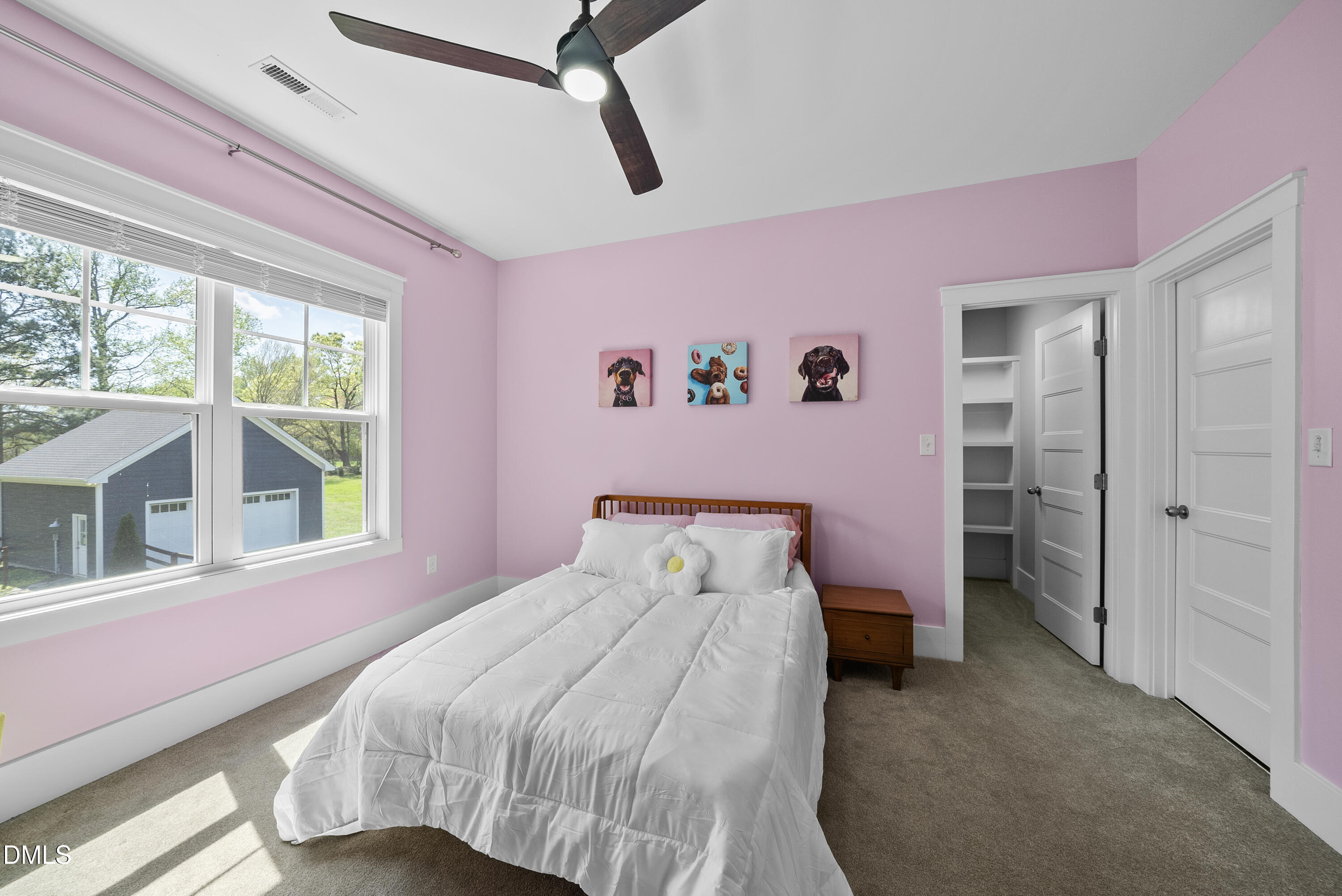 2416 Eddie Howard Road Willow Spring, NC 27592 - Photo 54 of 64 a bedroom with a bed and a large window