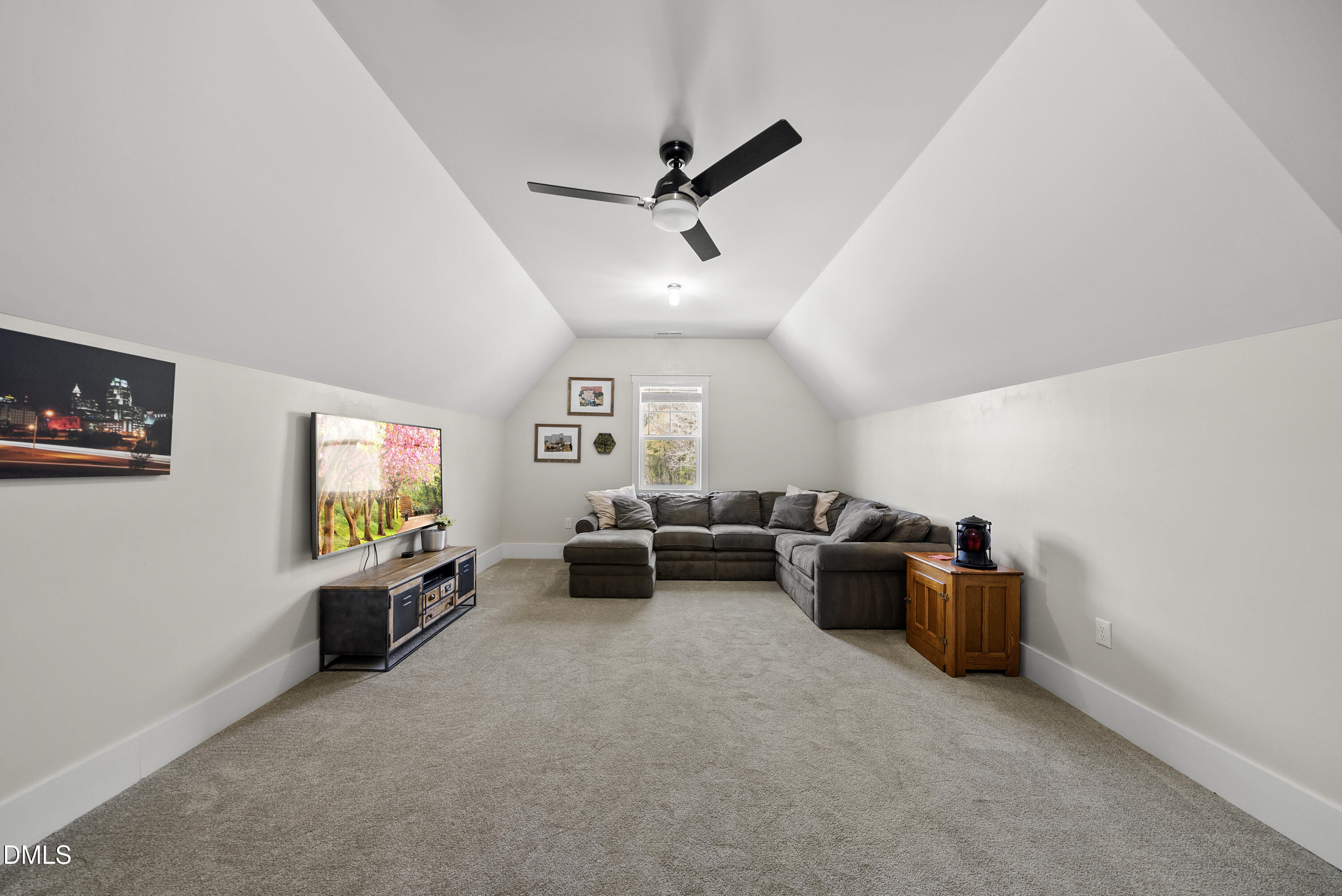 2416 Eddie Howard Road Willow Spring, NC 27592 - Photo 58 of 64 a living room with furniture and a window