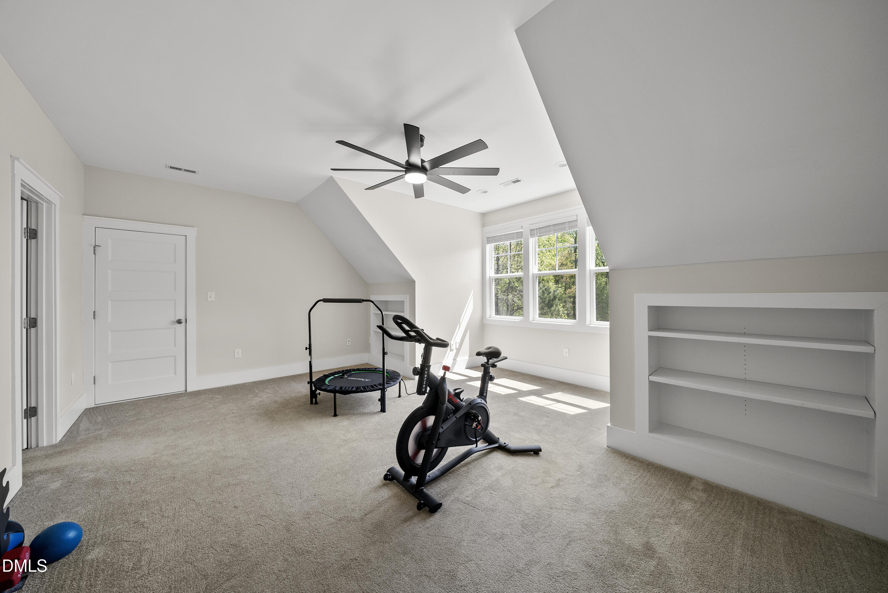 2416 Eddie Howard Road Willow Spring, NC 27592 - Photo 61 of 64 a view of a room with gym equipment