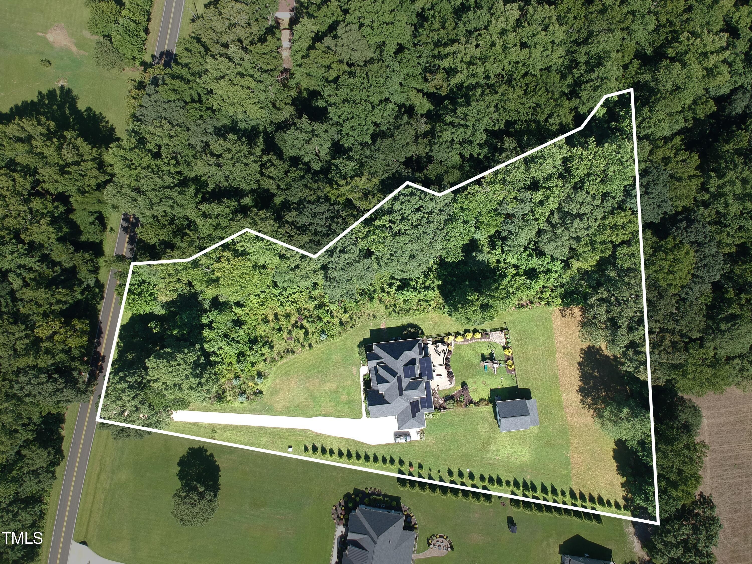 2416 Eddie Howard Road Willow Spring, NC 27592 - Photo 63 of 64 a view of a balcony and yard