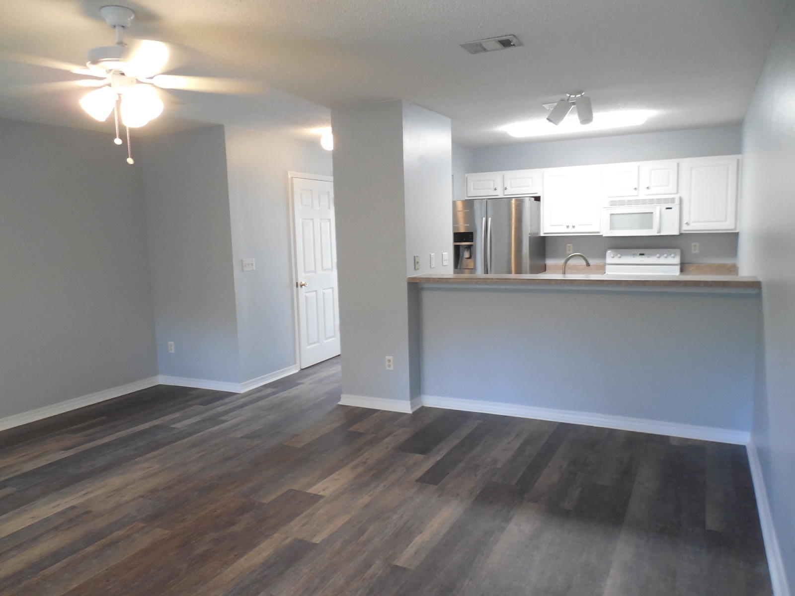 502 Keystone Road Mary Esther, FL 32569 - Photo 9 of 22 a view of kitchen with granite countertop cabinets and wooden floor