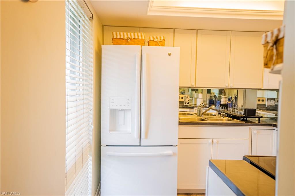 162 Teryl Road, Unit 4 Naples, FL 34112 - Photo 5 of 20 a kitchen with a refrigerator and a stove