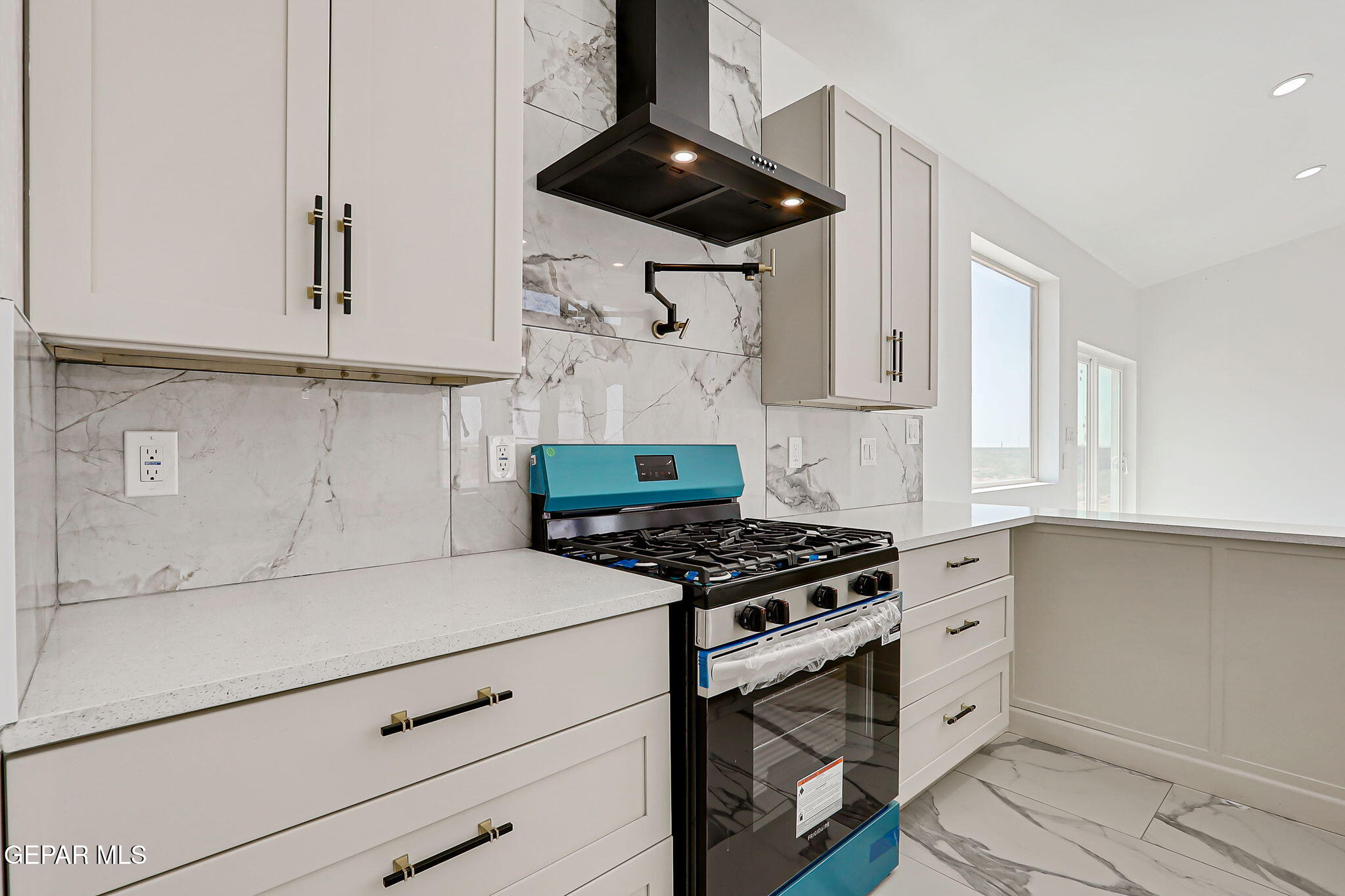 693 San Jose Chaparral, NM 88081 - Photo 12 of 40 a kitchen with stainless steel appliances a stove and cabinets