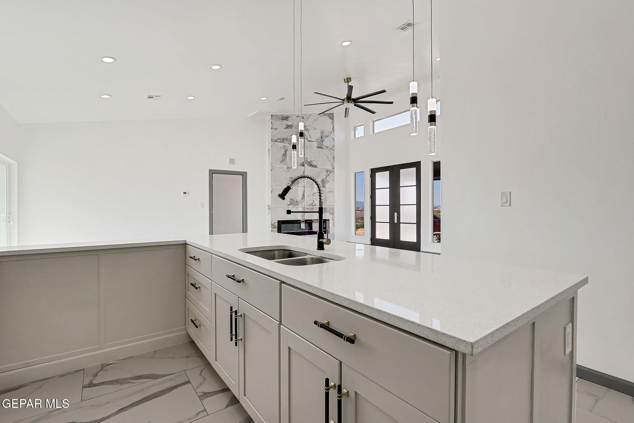 693 San Jose Chaparral, NM 88081 - Photo 13 of 40 a kitchen with a sink dishwasher and white cabinets
