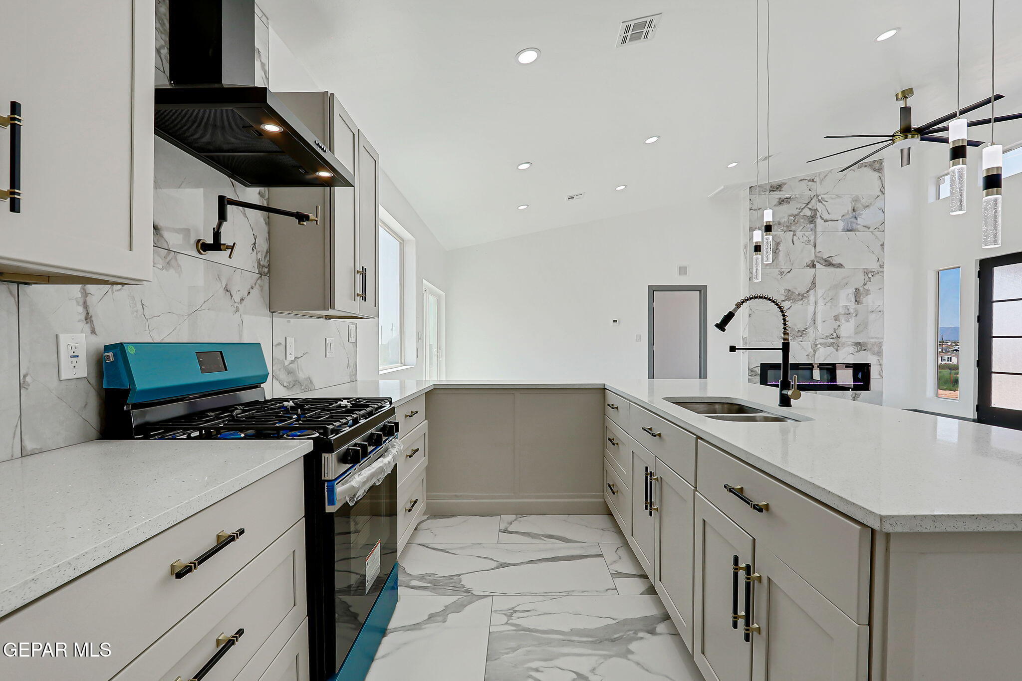 693 San Jose Chaparral, NM 88081 - Photo 16 of 40 a kitchen with stainless steel appliances a sink stove and cabinets