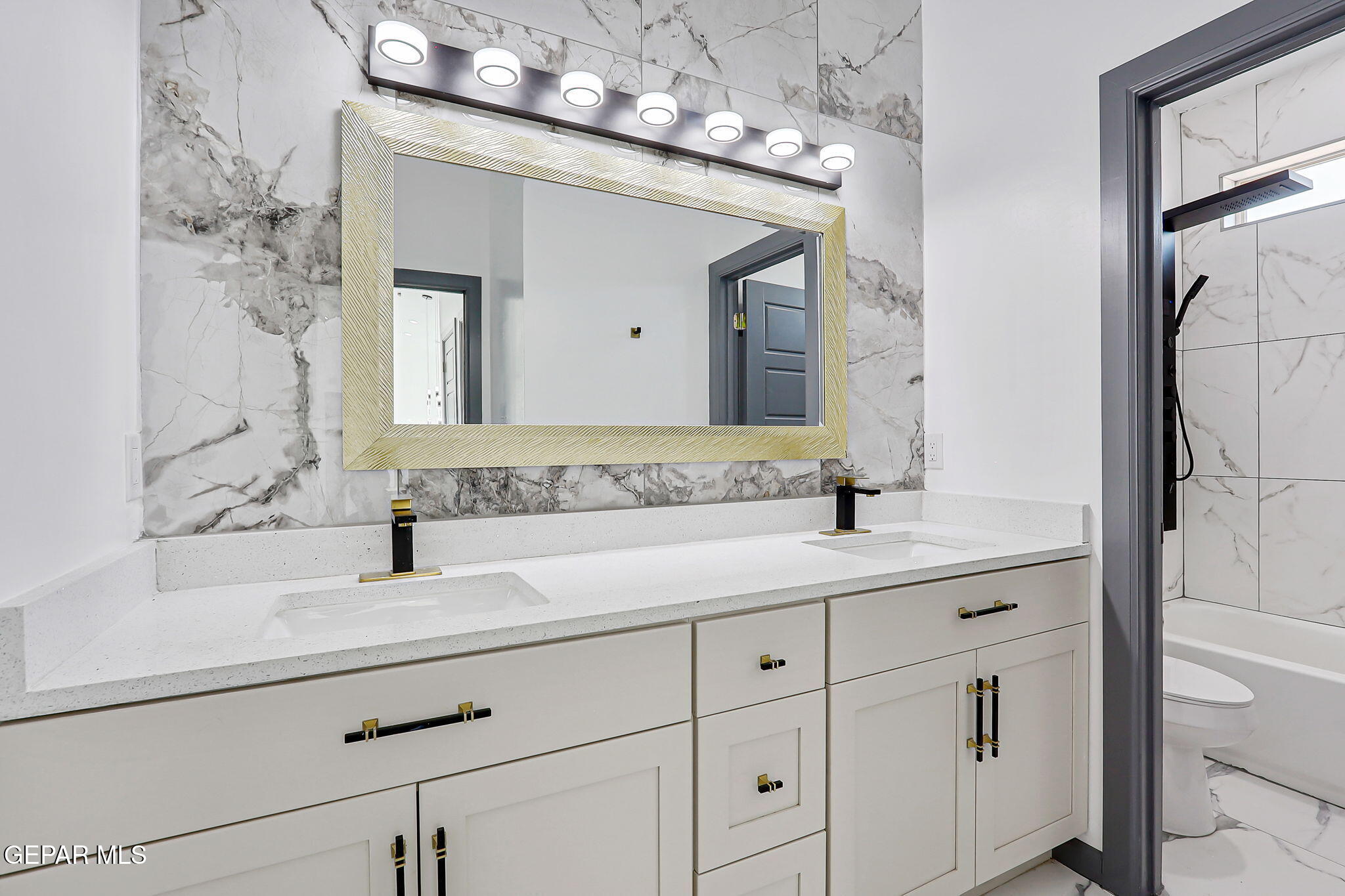693 San Jose Chaparral, NM 88081 - Photo 31 of 40 a bathroom with a sink and a mirror