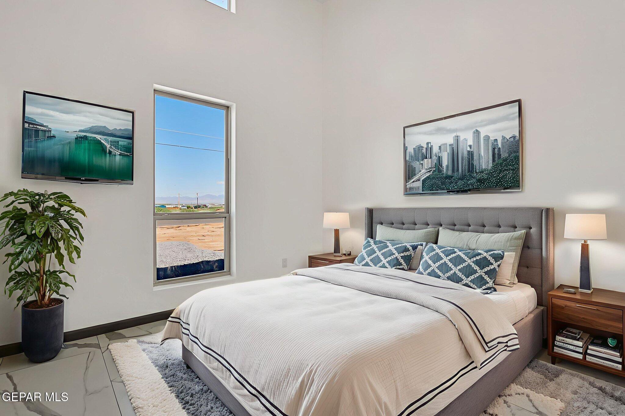 693 San Jose Chaparral, NM 88081 - Photo 34 of 40 a bedroom with bed and a potted plant