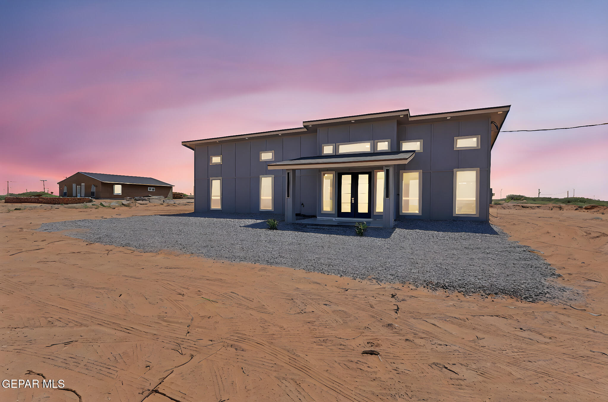 693 San Jose Chaparral, NM 88081 - Photo 5 of 41 a front view of a house with a yard