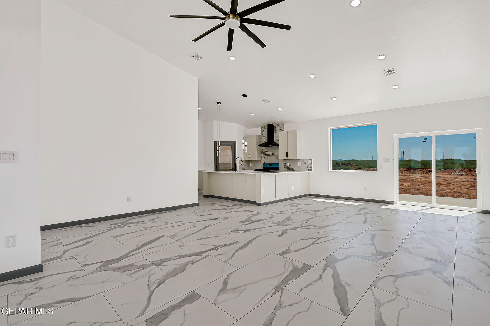 693 San Jose Chaparral, NM 88081 - Photo 6 of 40 a view of a kitchen with a sink and cabinets