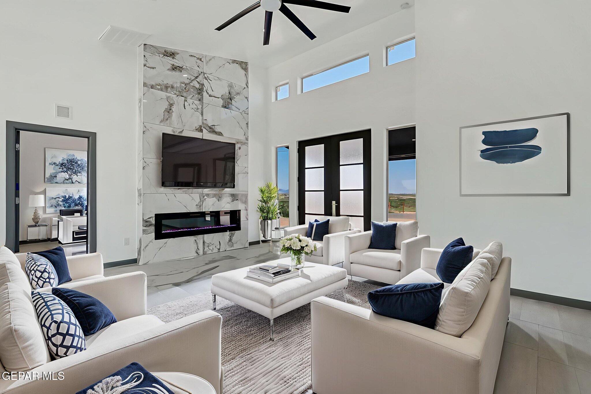 693 San Jose Chaparral, NM 88081 - Photo 8 of 40 a living room with furniture a flat screen tv and a fireplace