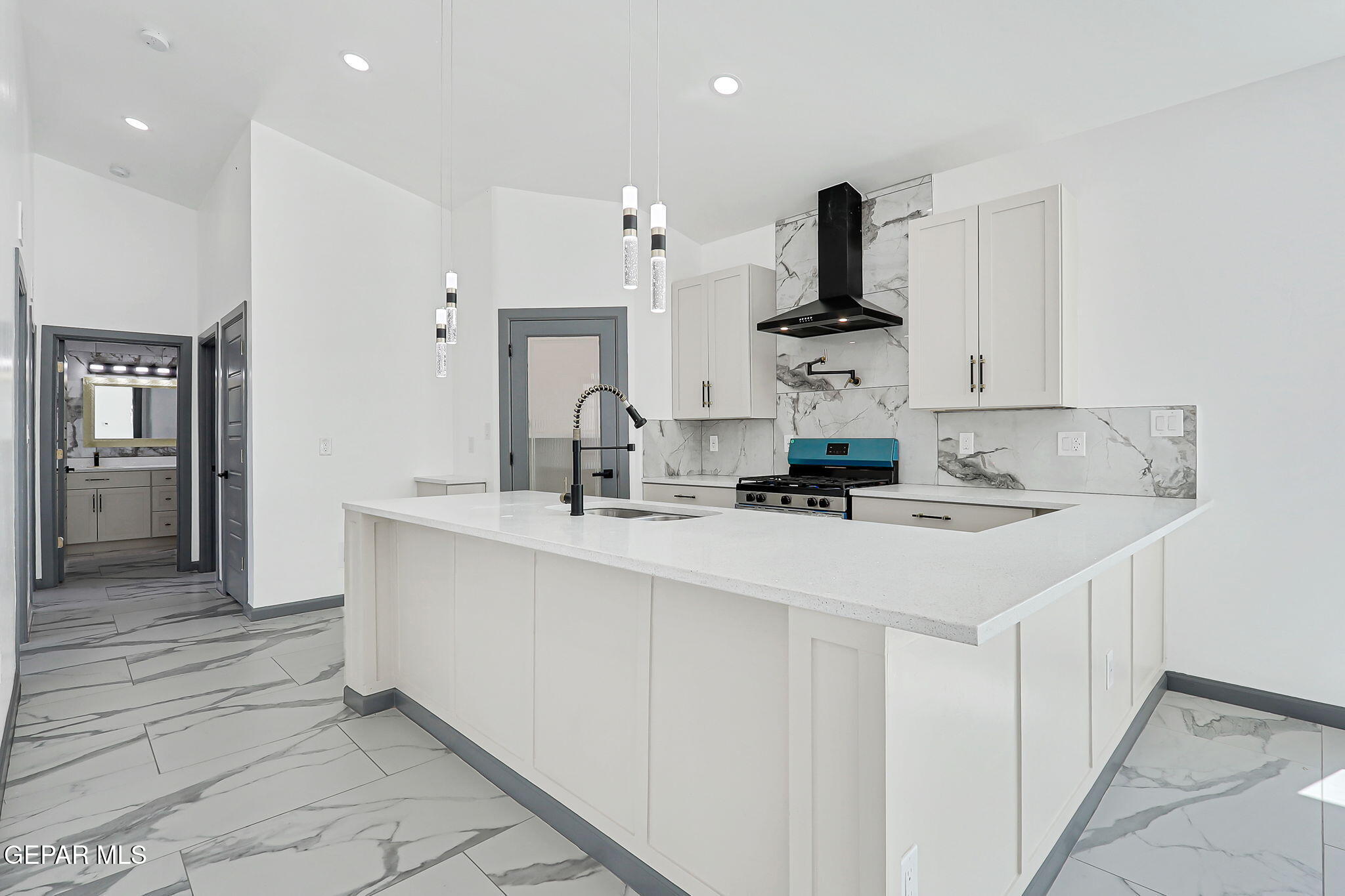 693 San Jose Chaparral, NM 88081 - Photo 9 of 40 a kitchen with stainless steel appliances a sink and cabinets