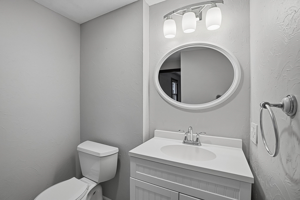 4 Carby Drive Mendon, MA 01756 - Photo 16 of 35 a bathroom with a sink a toilet and a mirror