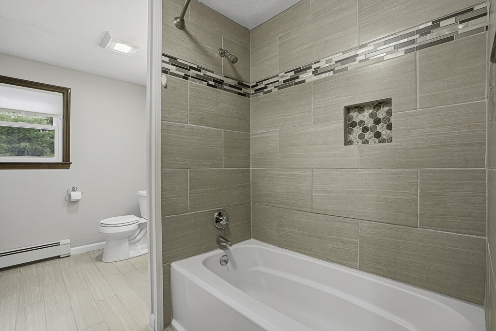 4 Carby Drive Mendon, MA 01756 - Photo 17 of 35 a bathroom with a toilet sink and shower