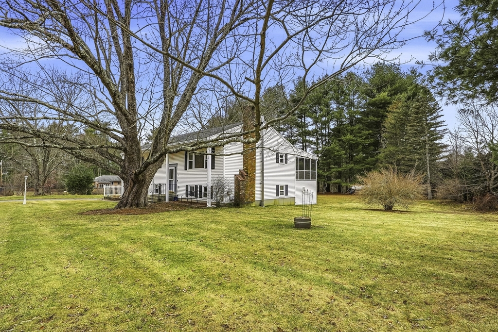 4 Carby Drive Mendon, MA 01756 - Photo 2 of 35 a view of a house with a big yard and large trees