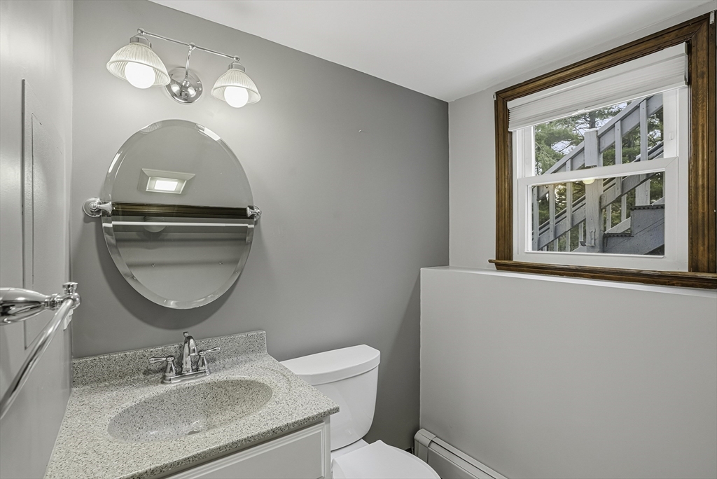 4 Carby Drive Mendon, MA 01756 - Photo 28 of 35 a bathroom with a toilet a sink and mirror