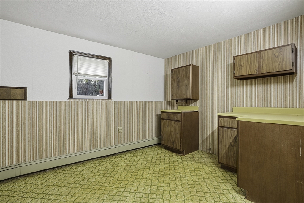 4 Carby Drive Mendon, MA 01756 - Photo 30 of 35 a view of a kitchen with fridge and wooden floor