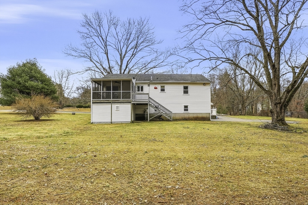4 Carby Drive Mendon, MA 01756 - Photo 32 of 35 a front view of house with yard and trees