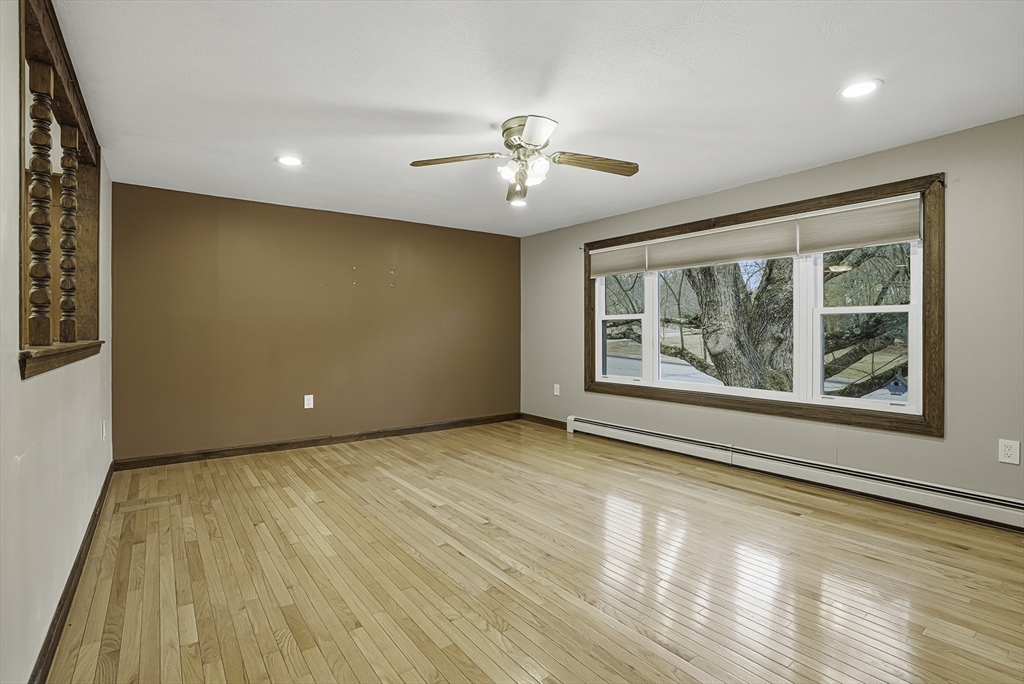 4 Carby Drive Mendon, MA 01756 - Photo 5 of 35 a view of an empty room with wooden floor and a window