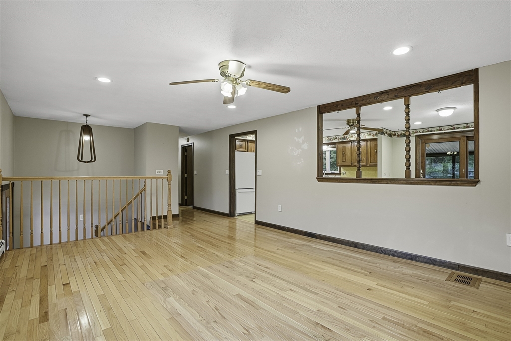 4 Carby Drive Mendon, MA 01756 - Photo 6 of 35 a view of an empty room with wooden floor and a window