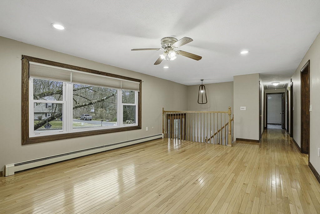 4 Carby Drive Mendon, MA 01756 - Photo 7 of 35 a view of empty room with wooden floor and fan