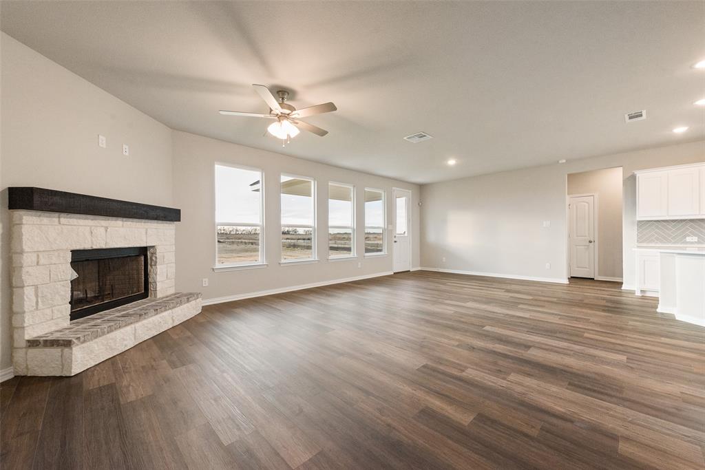 1230 County Road 200 Valley View, TX 76272 - Photo 11 of 26 Unfurnished living room featuring dark wood-style floors, a fireplace, a ceiling fan, and recessed lighting