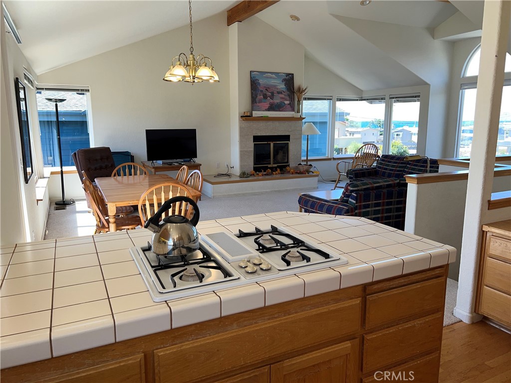 330 Jean Street Cambria, CA 93428 - Photo 20 of 75 a living room with furniture a flat screen tv and a fireplace