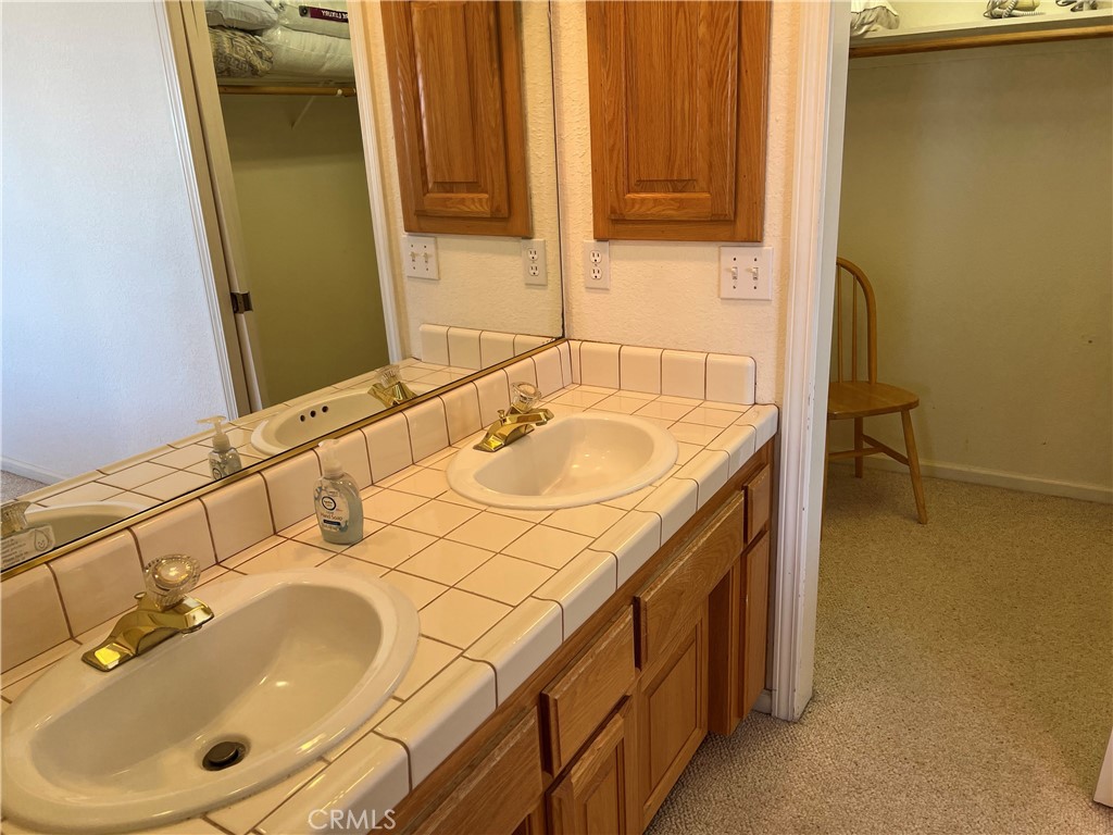 330 Jean Street Cambria, CA 93428 - Photo 36 of 75 a bathroom with a sink and a mirror