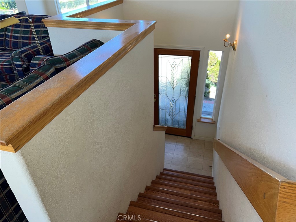 330 Jean Street Cambria, CA 93428 - Photo 40 of 75 a view of a hallway with wooden floor and staircase