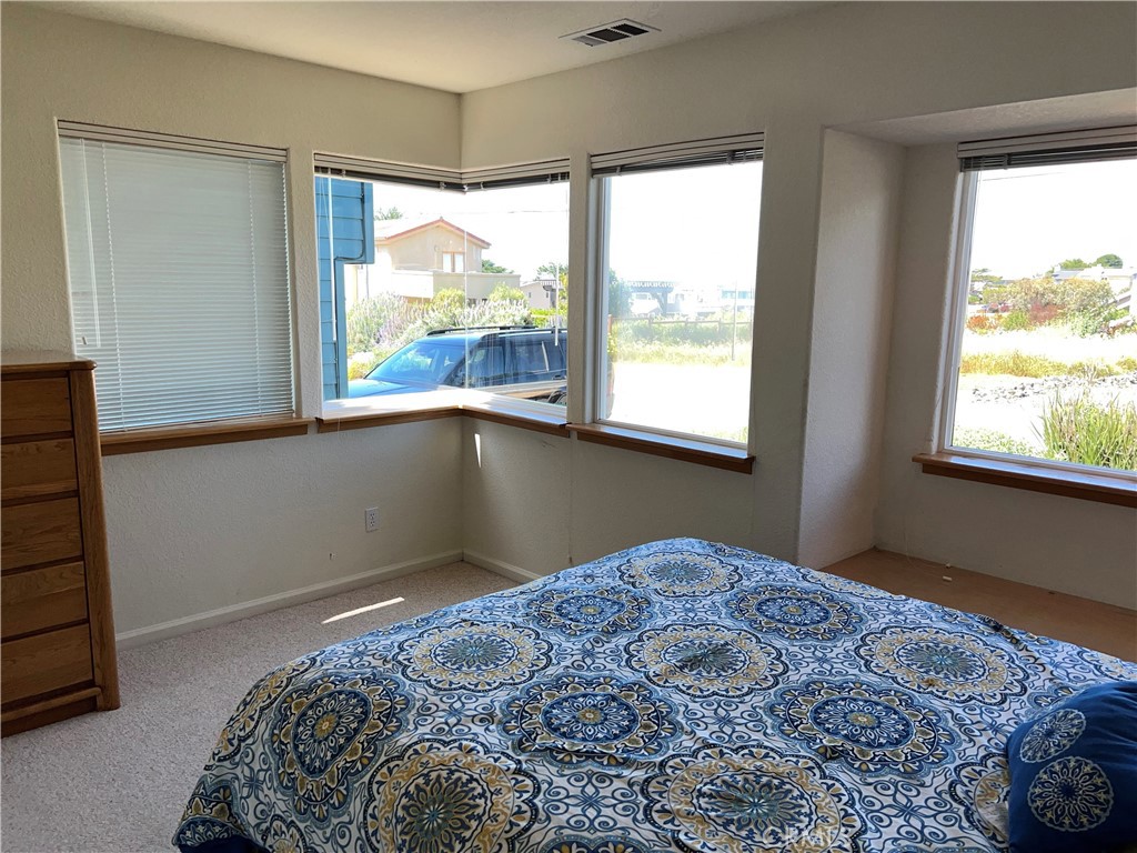 330 Jean Street Cambria, CA 93428 - Photo 45 of 75 a bedroom with a bed and a window