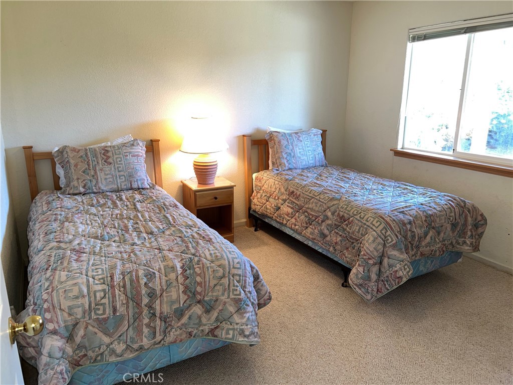 330 Jean Street Cambria, CA 93428 - Photo 47 of 75 a bedroom with two beds and a window