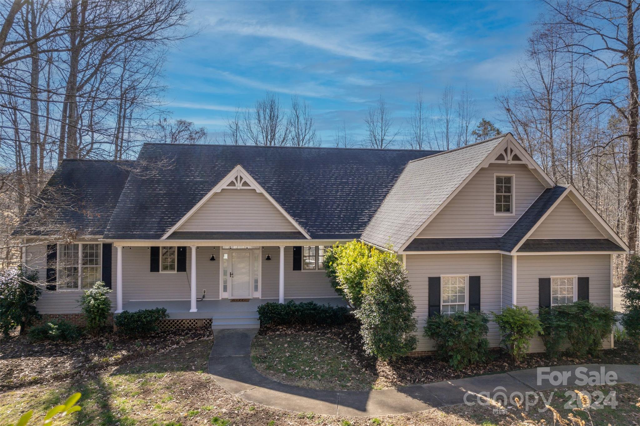 136 General Griffith Circle Rutherfordton, NC 28139 - Photo 1 of 47 a front view of a house with garden
