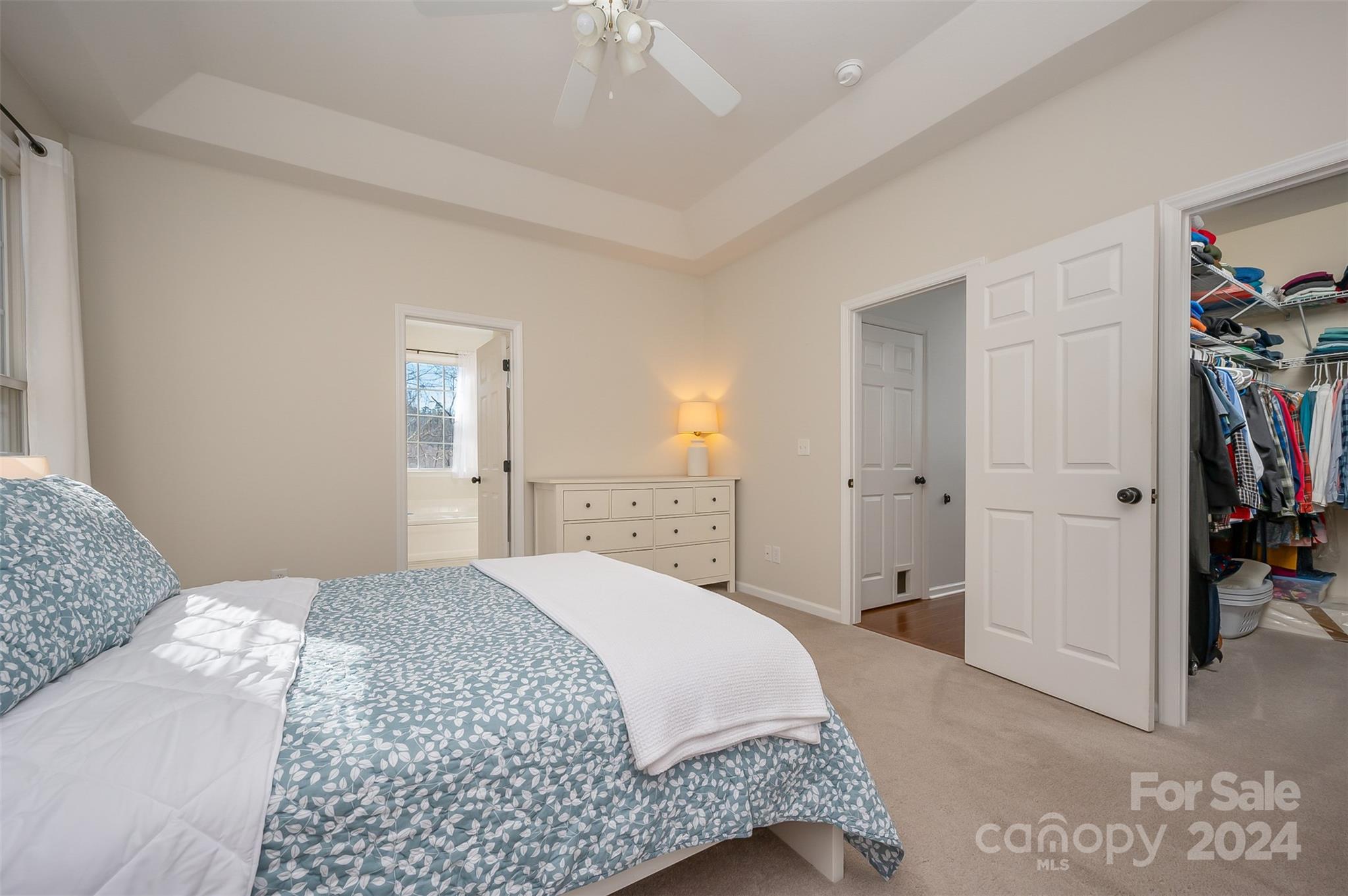 136 General Griffith Circle Rutherfordton, NC 28139 - Photo 14 of 47 a bedroom with a bed and a painting on the wall