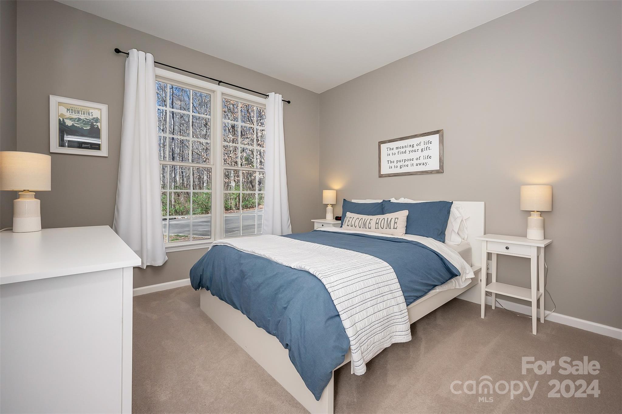 136 General Griffith Circle Rutherfordton, NC 28139 - Photo 19 of 47 a bedroom with a bed and a table lamp