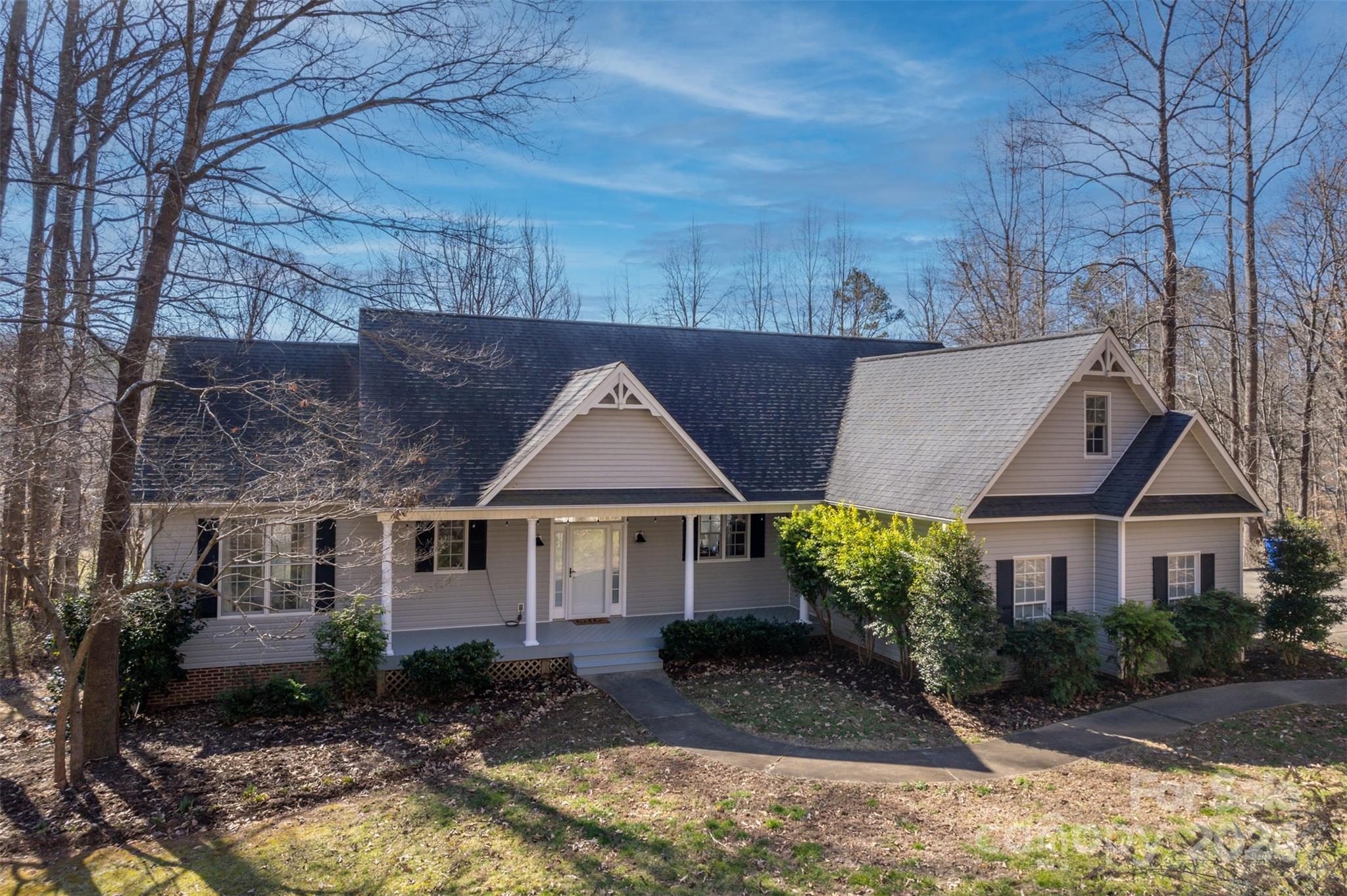 136 General Griffith Circle Rutherfordton, NC 28139 - Photo 2 of 47 a front view of a house with garden