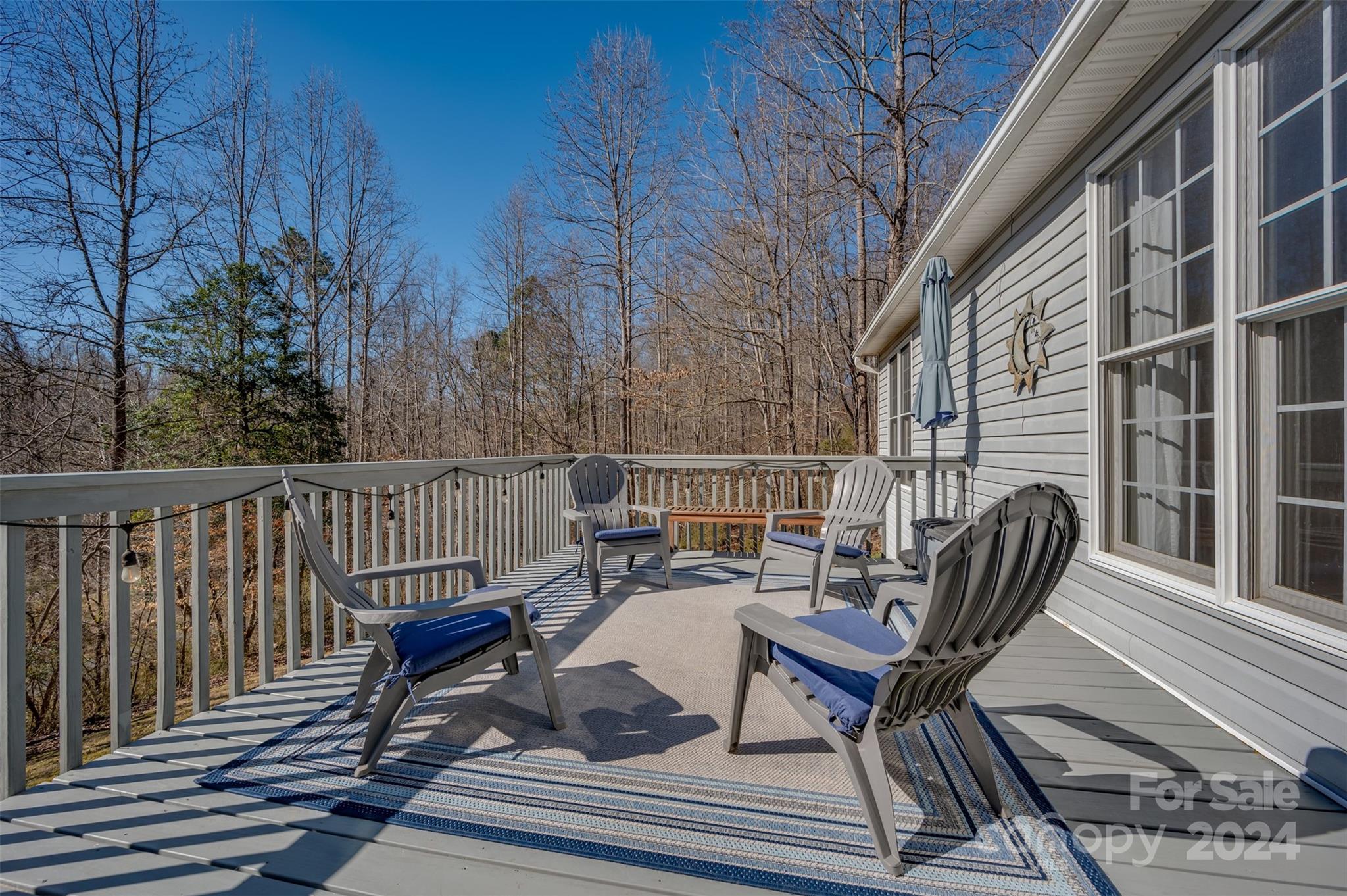 136 General Griffith Circle Rutherfordton, NC 28139 - Photo 24 of 47 a view of a chairs in wooden deck