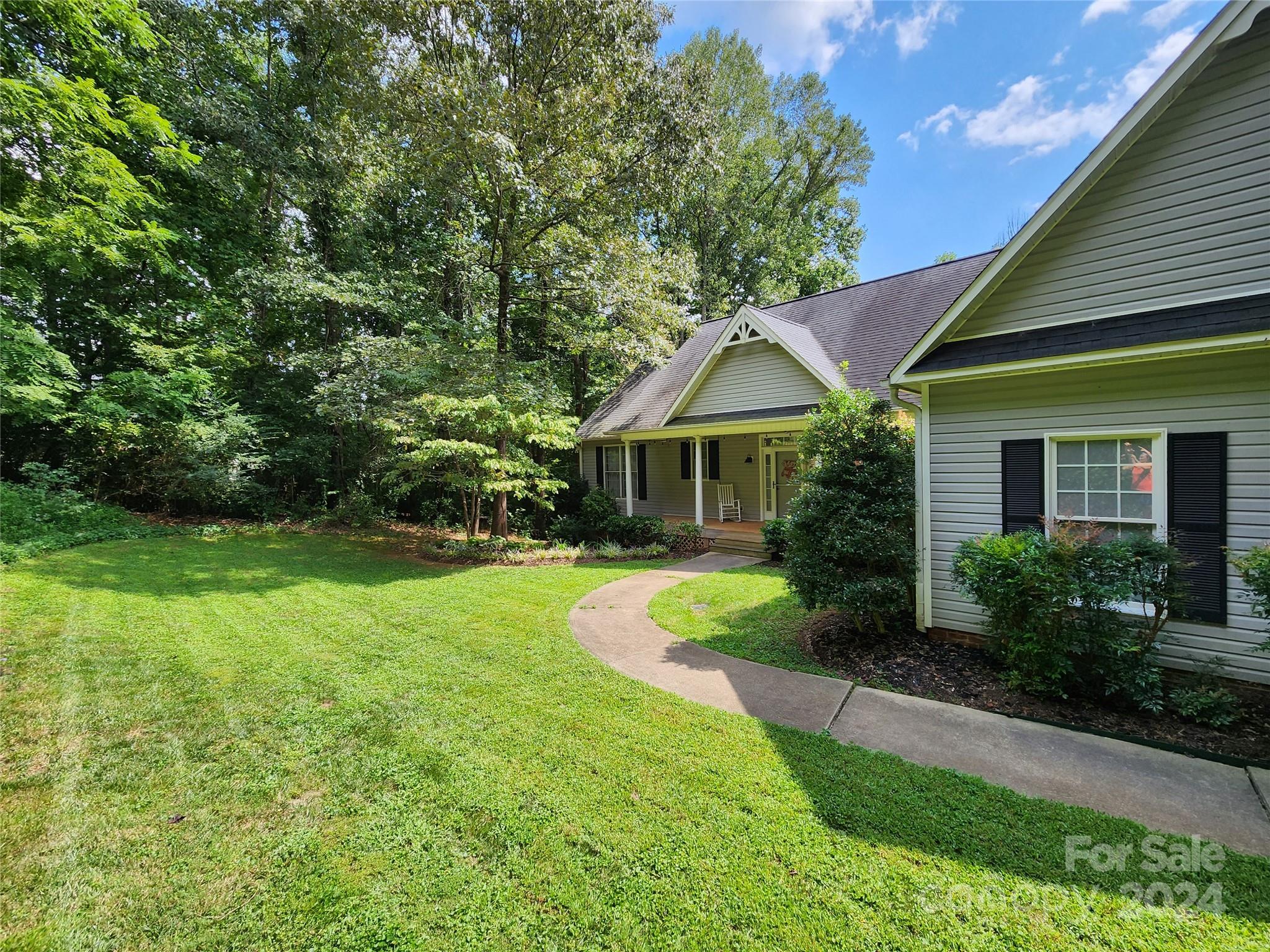 136 General Griffith Circle Rutherfordton, NC 28139 - Photo 46 of 47 a front view of house with yard and green space