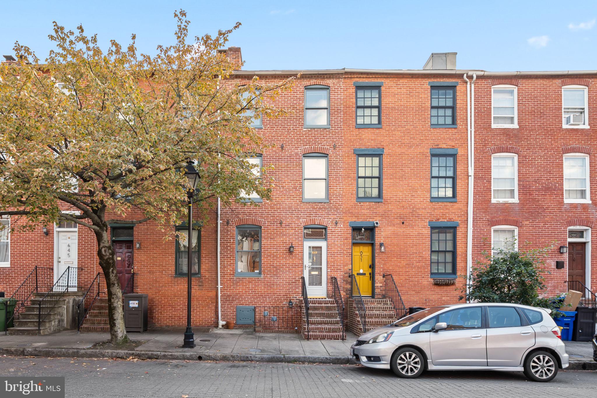 649 Portland Street Baltimore, MD 21230 - Photo 2 of 34 a car parked in front of a building