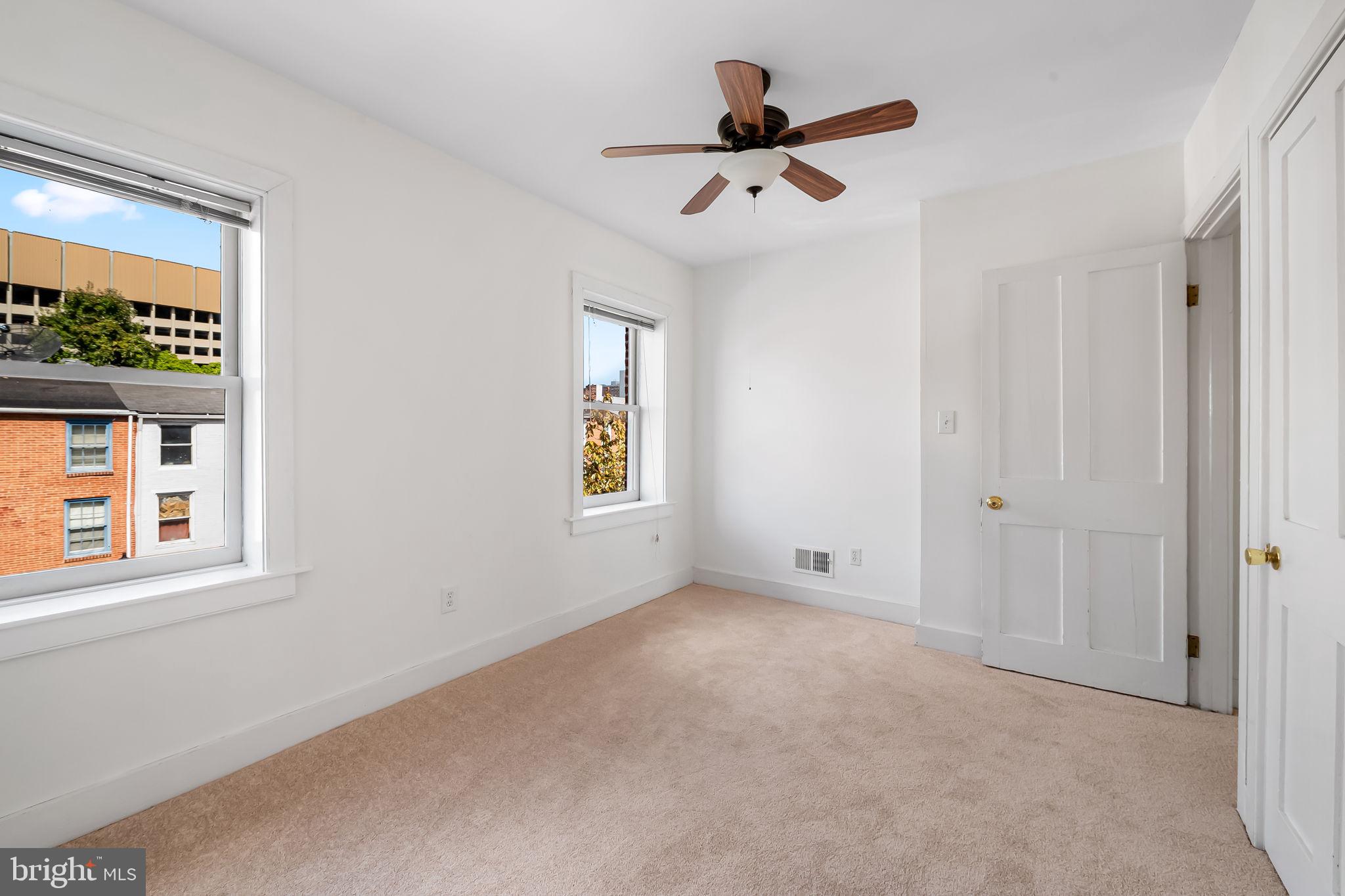 649 Portland Street Baltimore, MD 21230 - Photo 21 of 34 a view of room with a ceiling fan and window