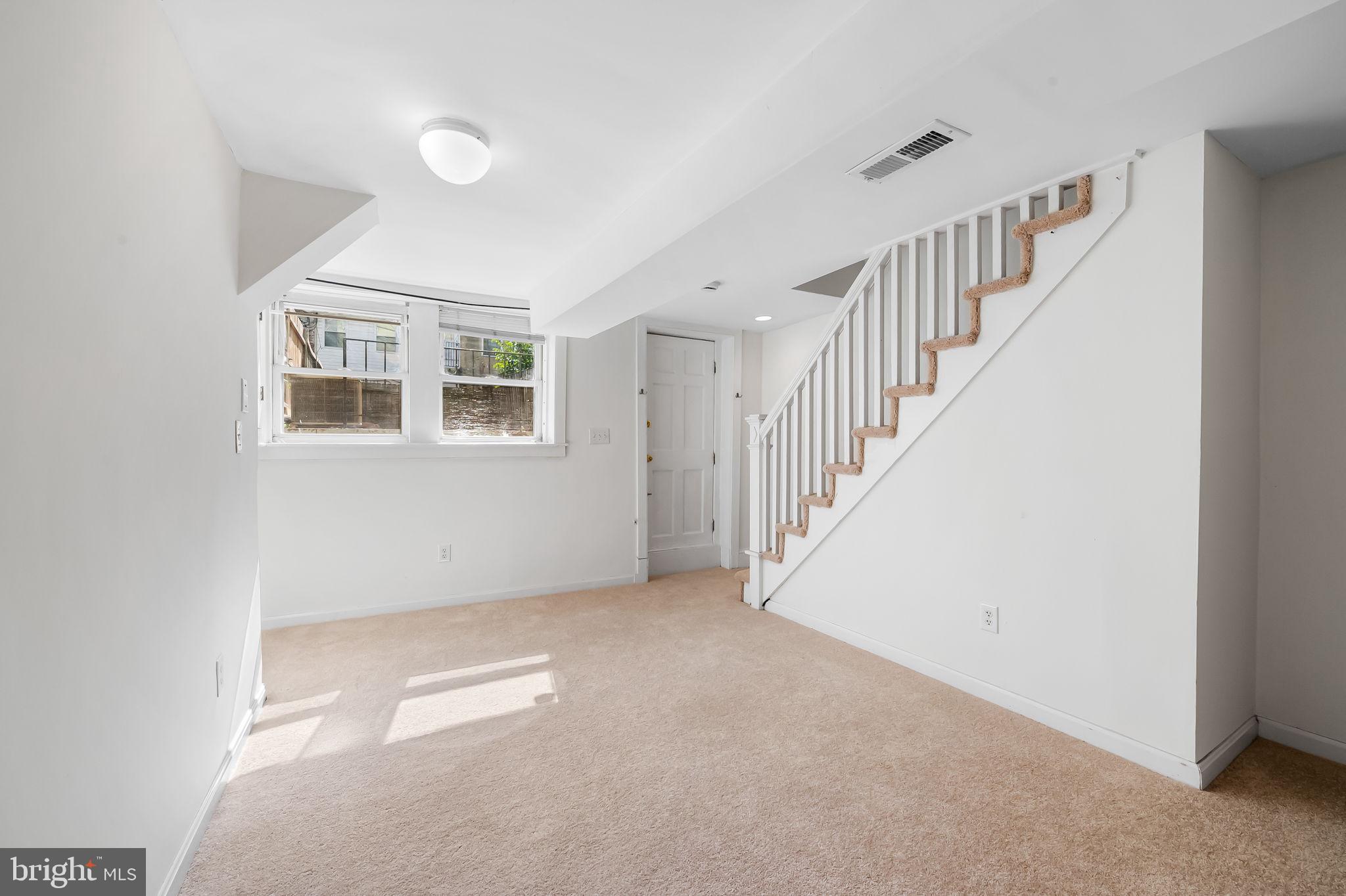 649 Portland Street Baltimore, MD 21230 - Photo 26 of 34 a view of an empty room with stairs