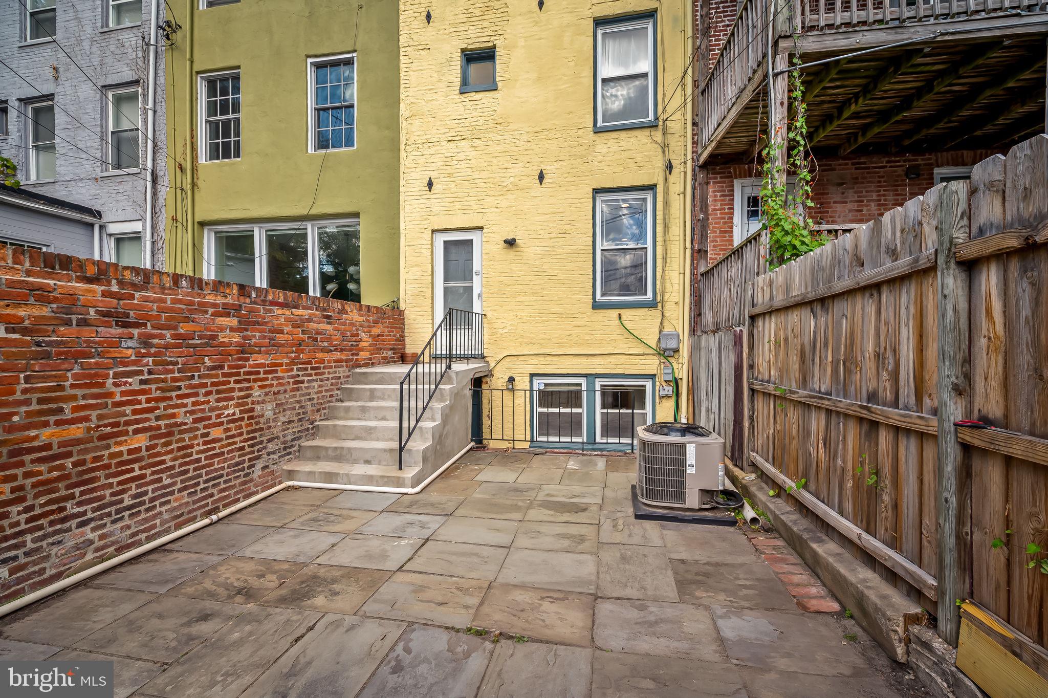 649 Portland Street Baltimore, MD 21230 - Photo 33 of 34 a view of a blue house with many windows