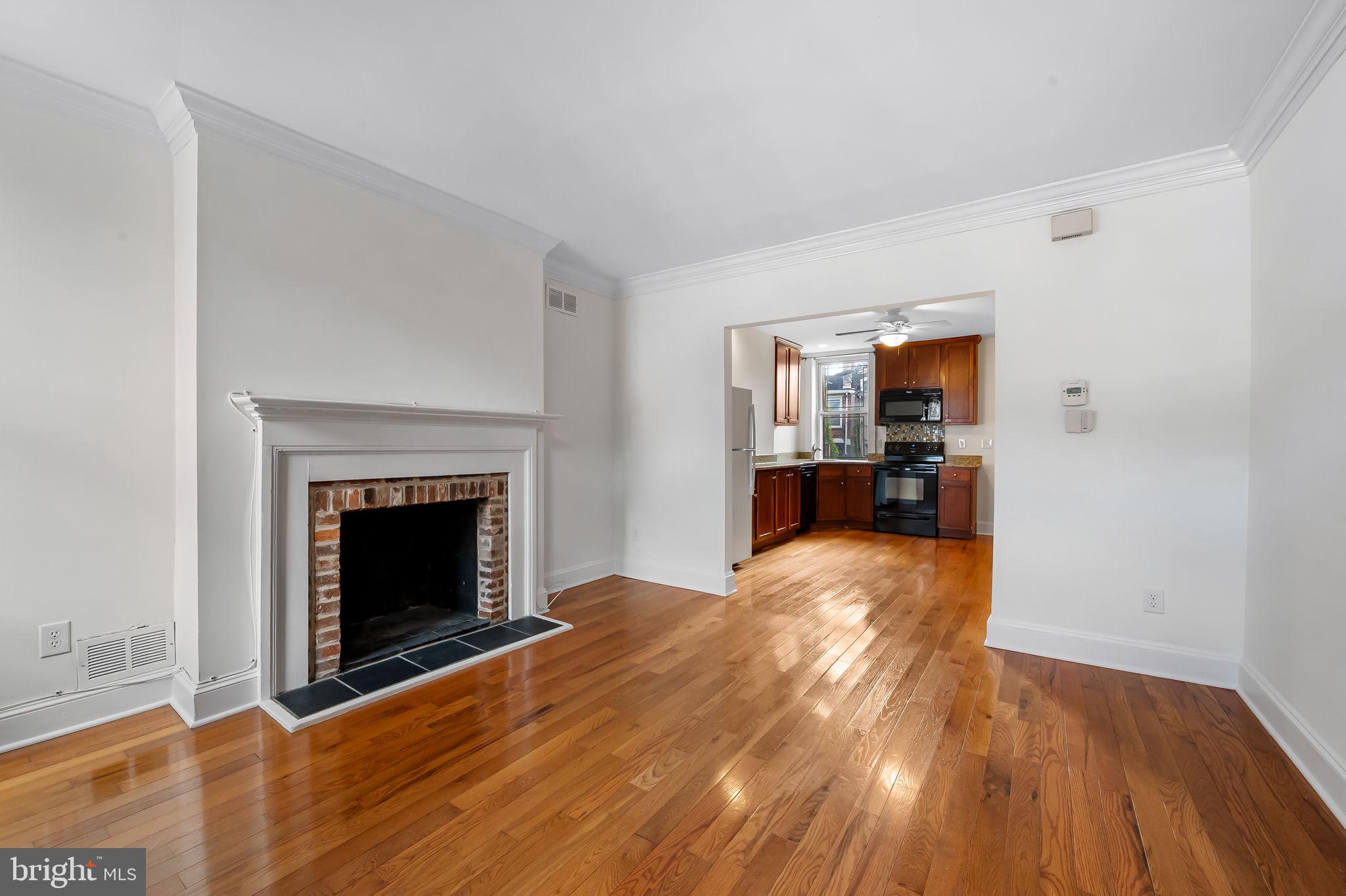 649 Portland Street Baltimore, MD 21230 - Photo 5 of 34 a view of livingroom with a fireplace