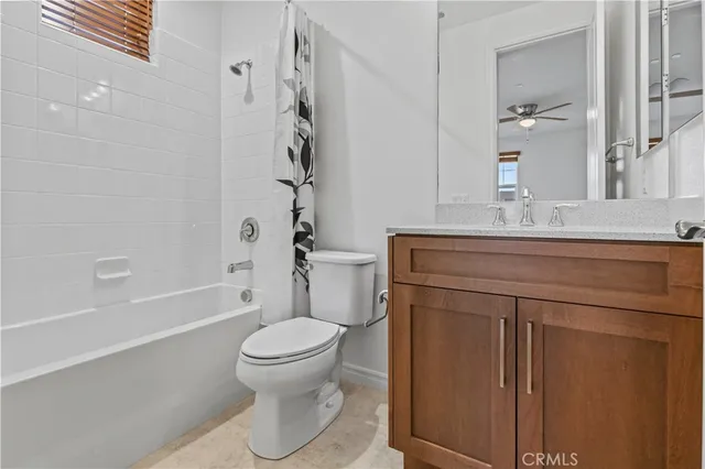 a living room with furniture and flowers