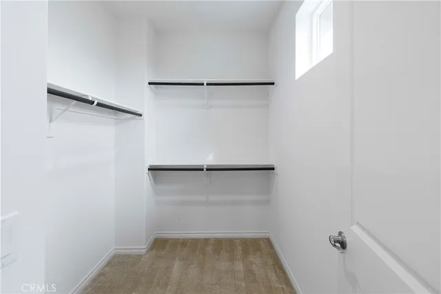 a bathroom with a double vanity sink mirror and shower