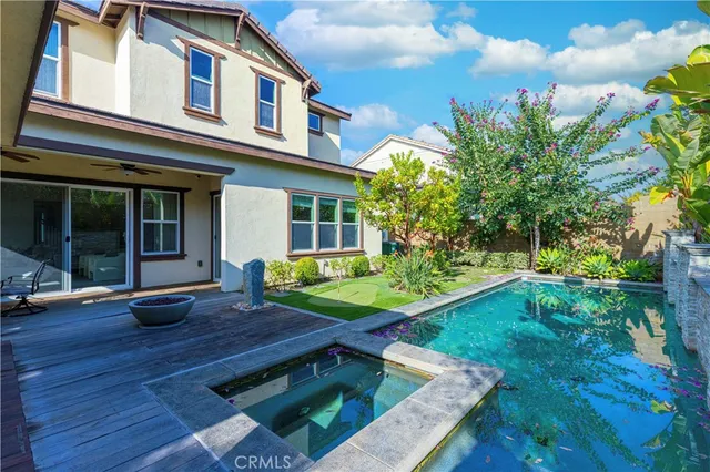 an aerial view of residential houses with city view